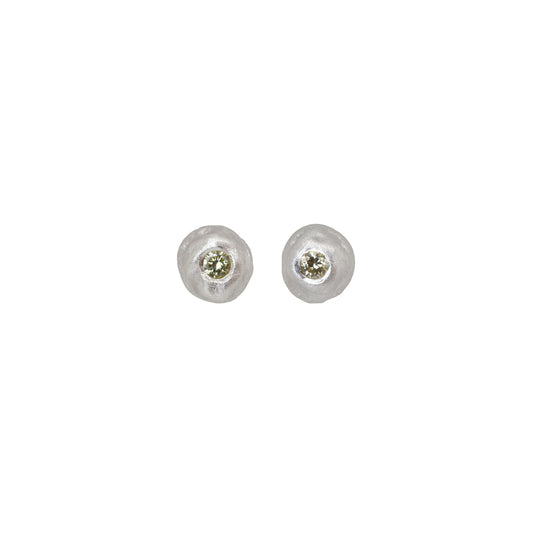 Pair of silver stud earrings with yellow diamonds on a white background