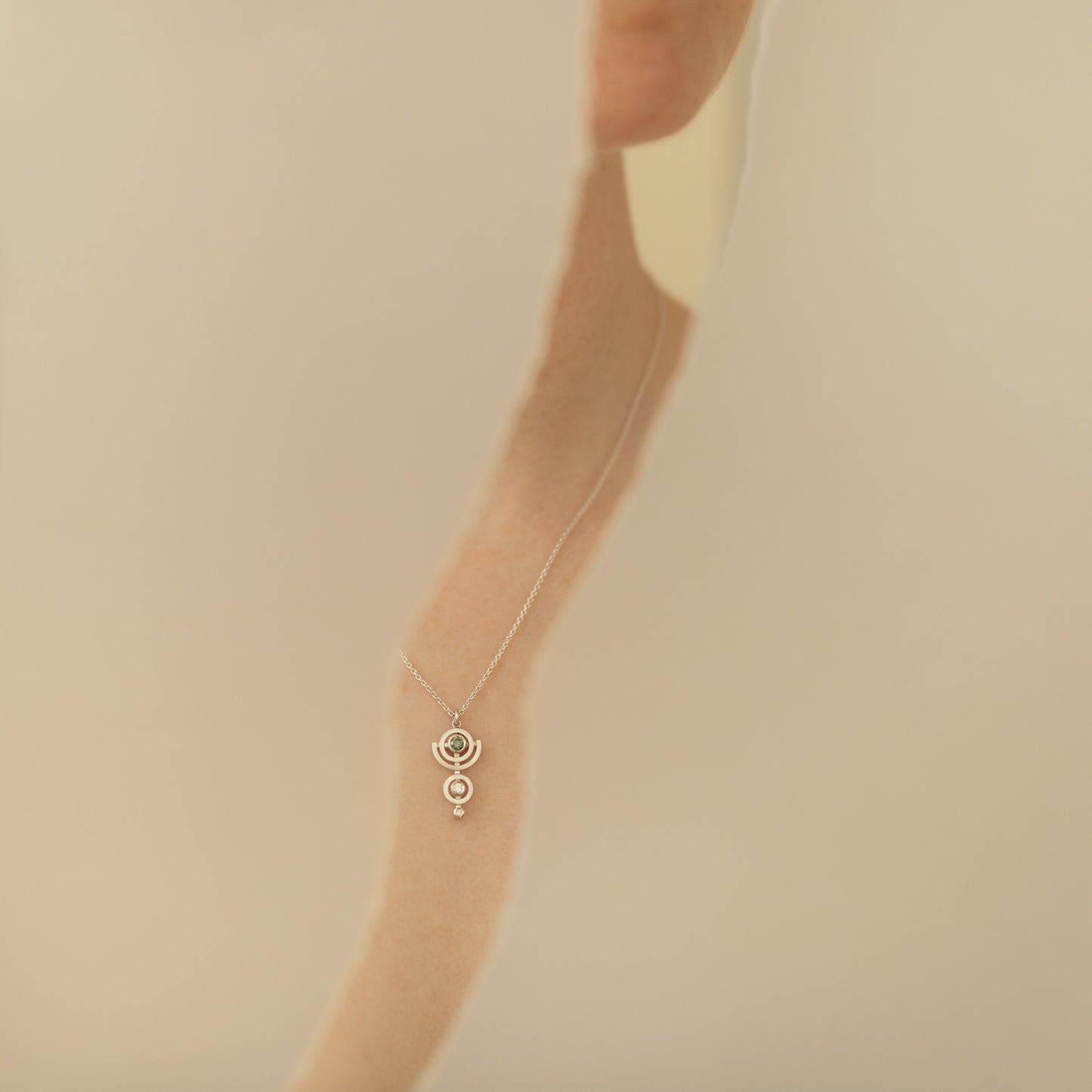 Delicate silver and diamond pendant necklace modelled