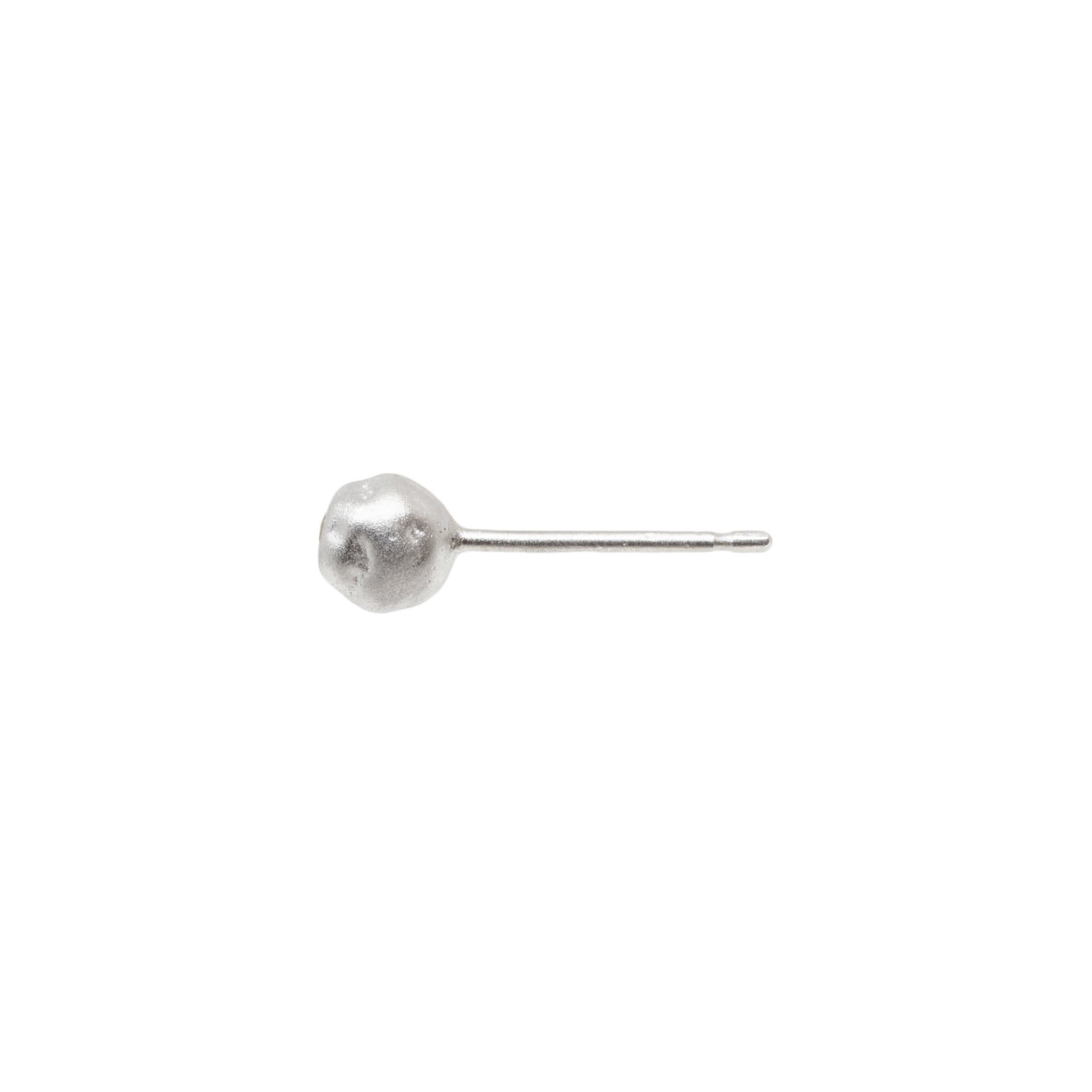 Silver ball earring on a white background