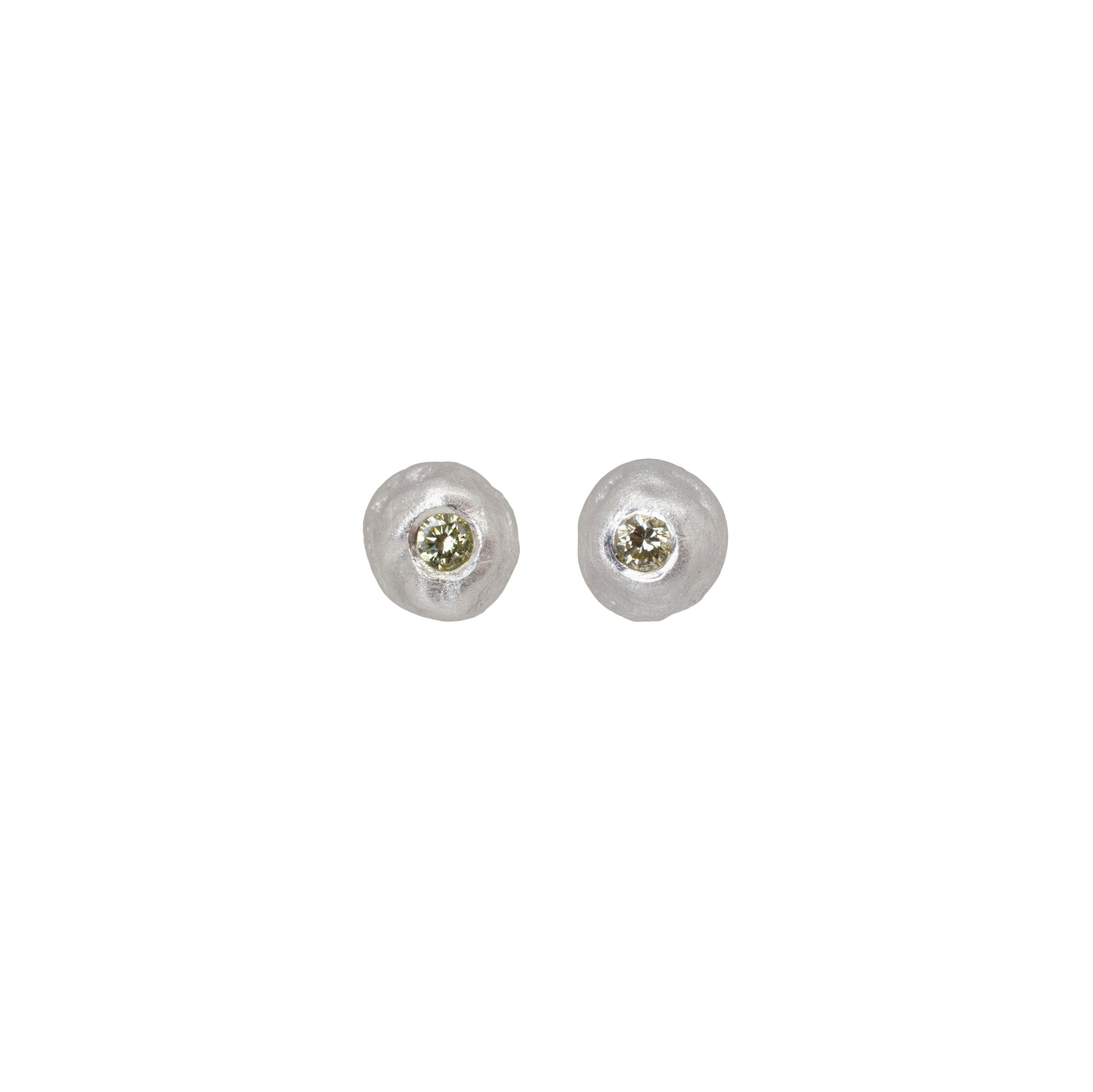 Pair of silver stud earrings with yellow diamonds on a white background