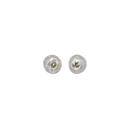Pair of silver stud earrings with yellow diamonds on a white background