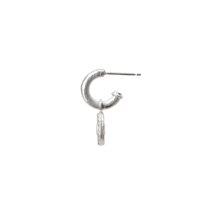 Silver hoop earring with a diamond charm on a white background