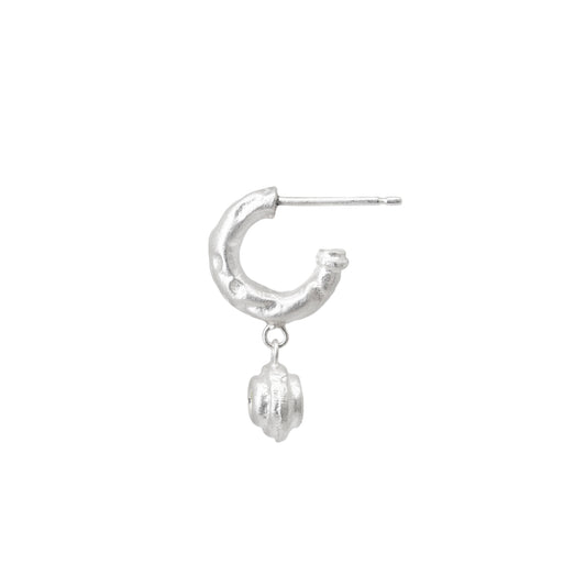 Silver hoop earring with a small round sapphire charm on a white background