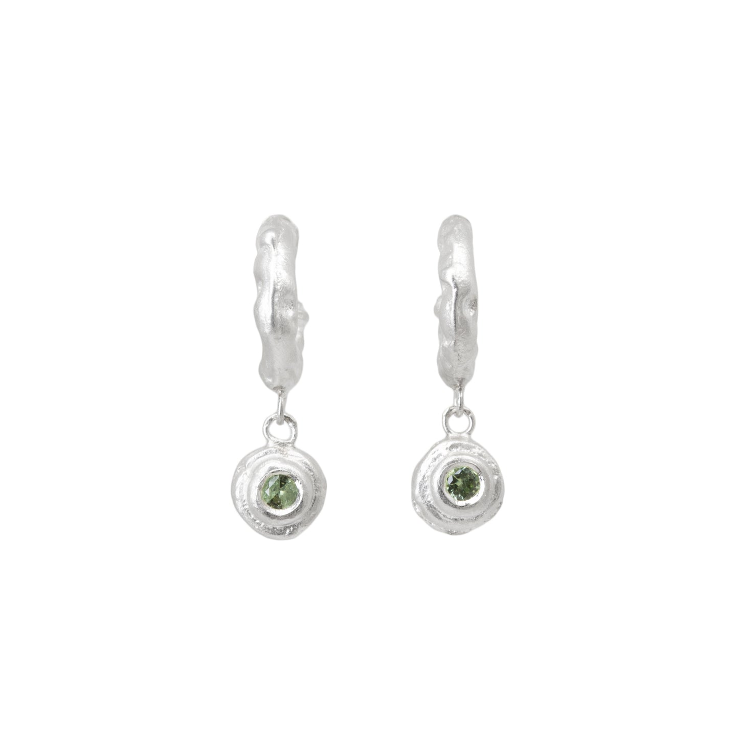 Pair of silver hoop earrings with green sapphires on a white background