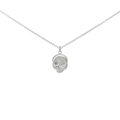 Sterling silver and yellow diamond skull pendant necklace on a white background