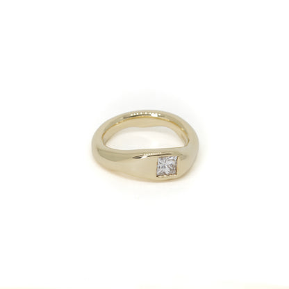 A yellow gold shaped wedding ring with a single princess-cut diamond flush set, shown on a plain white background.