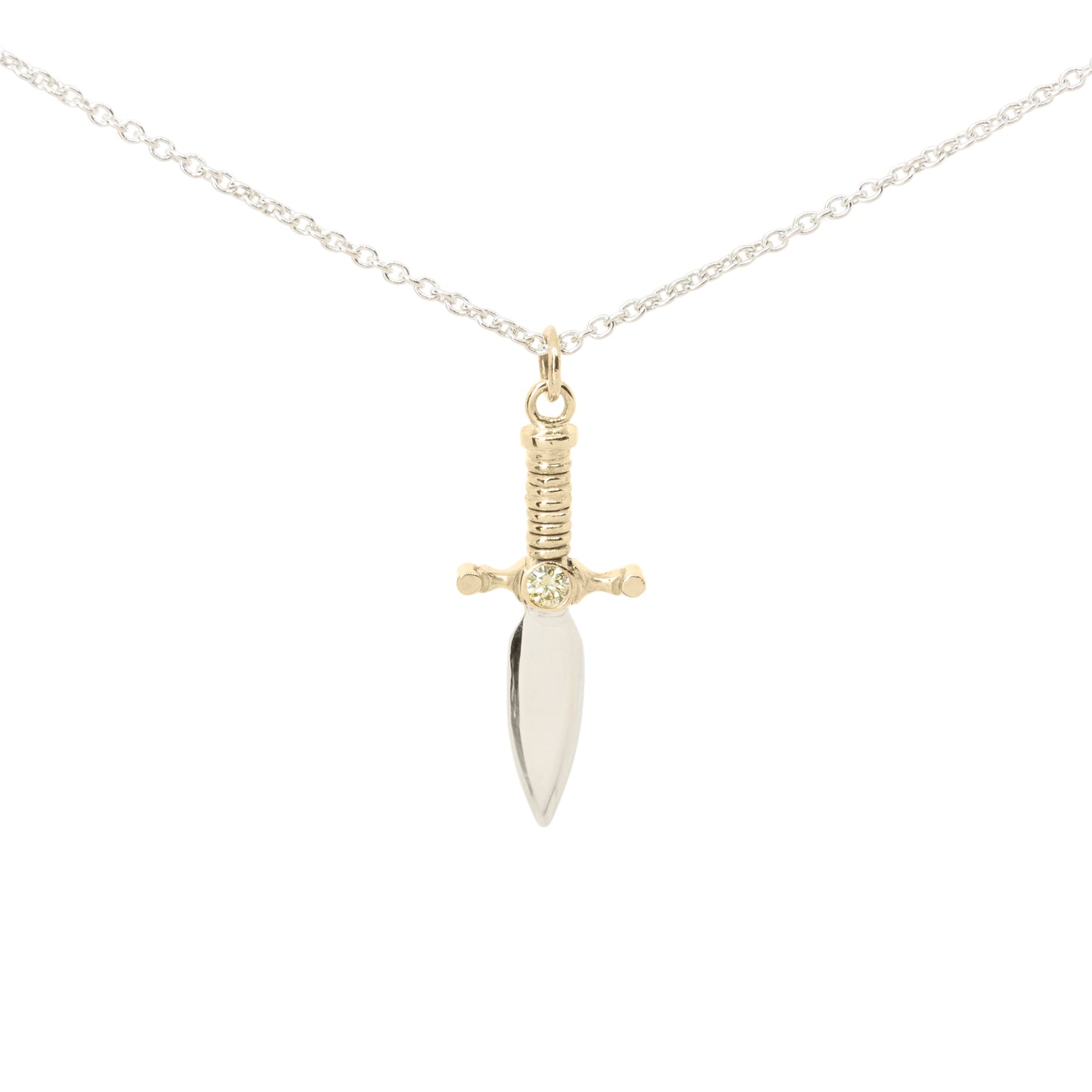 A dagger pendant necklace on a delicate silver chain, featuring a polished silver blade and a 9ct yellow gold hilt with yellow diamond set in the centre, set against a plain white background.