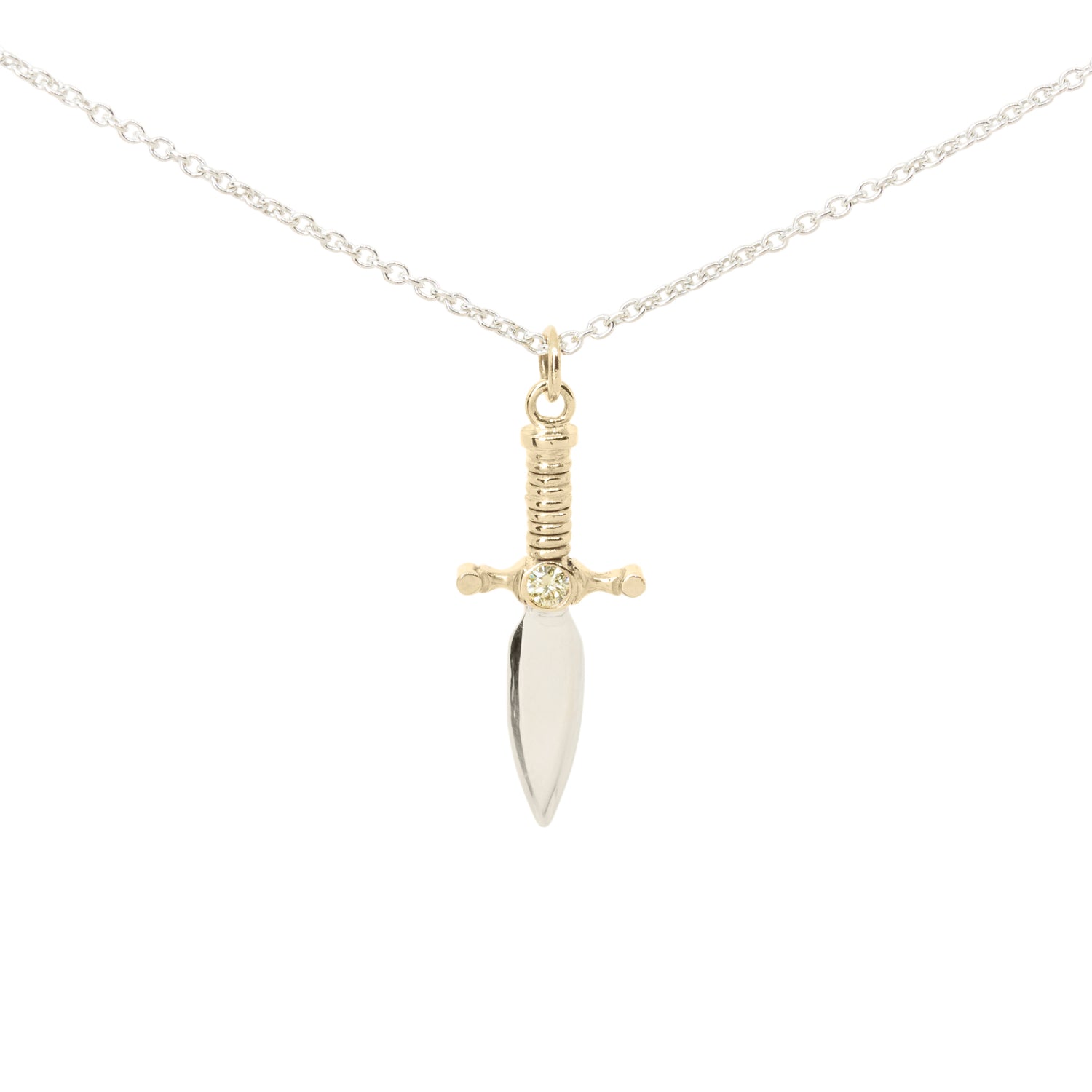 A dagger pendant necklace on a delicate silver chain, featuring a polished silver blade and a 9ct yellow gold hilt with yellow diamond set in the centre, set against a plain white background.