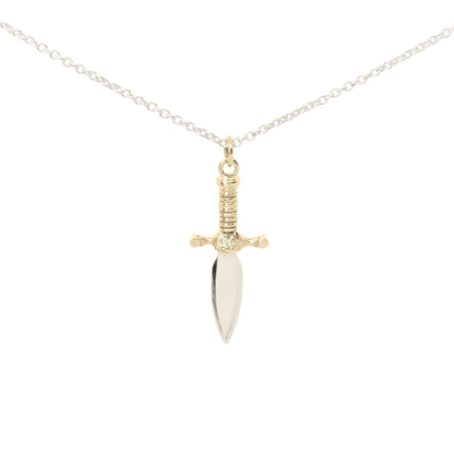 A dagger pendant necklace on a delicate silver chain, featuring a polished silver blade and a 9ct yellow gold hilt with yellow diamond set in the centre, set against a plain white background.
