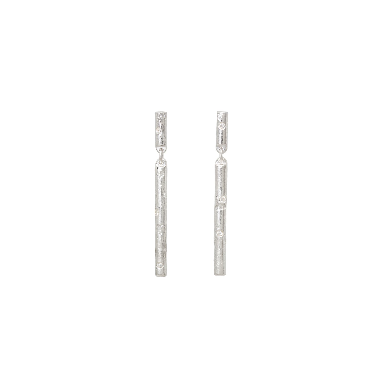 Pair of silver stud earrings with diamonds on a white background