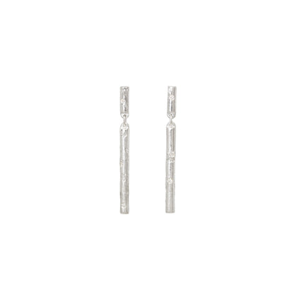 Pair of silver stud earrings with diamonds on a white background