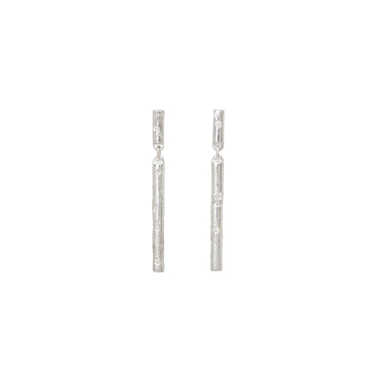 Pair of silver stud earrings with diamonds on a white background