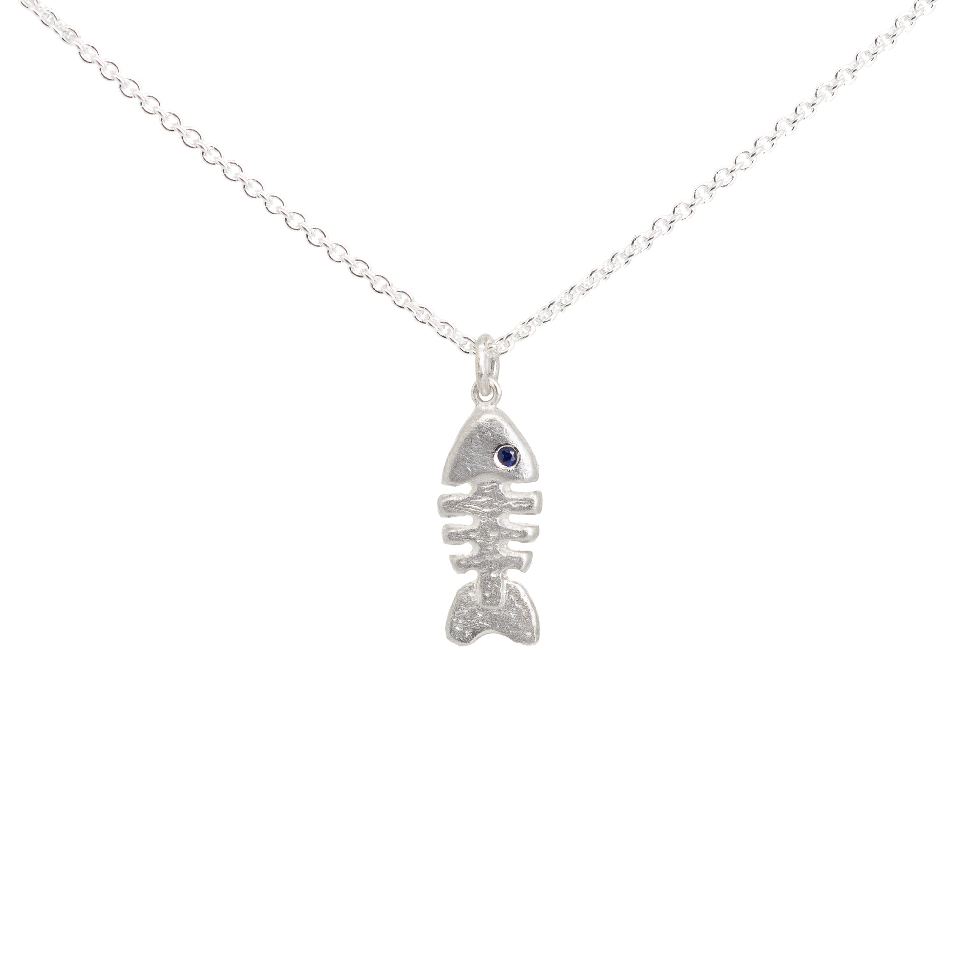 Silver fish bone skeleton necklace with a sapphire eye on a white background