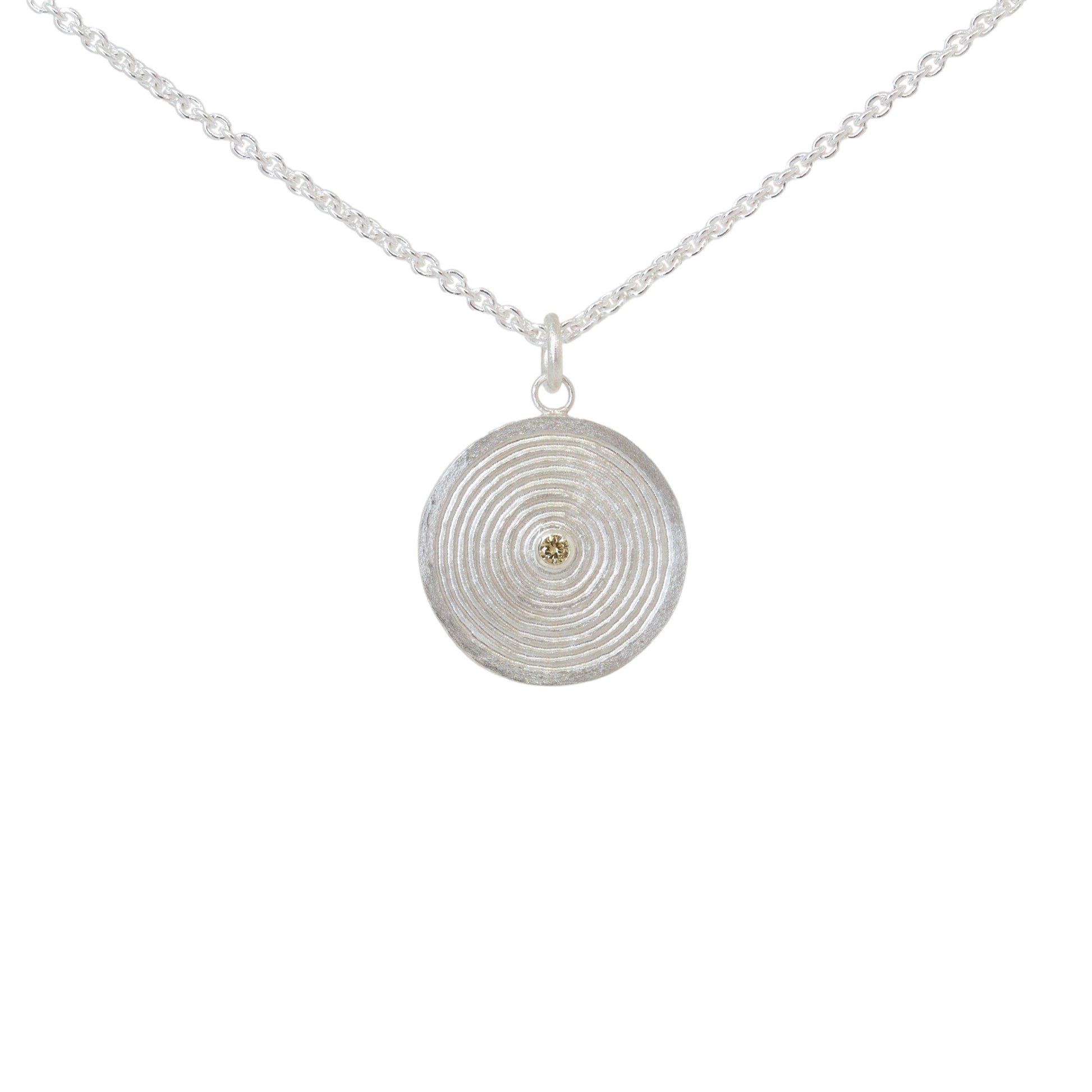 Sterling silver pendant necklace with a circular design set with a yellow diamond