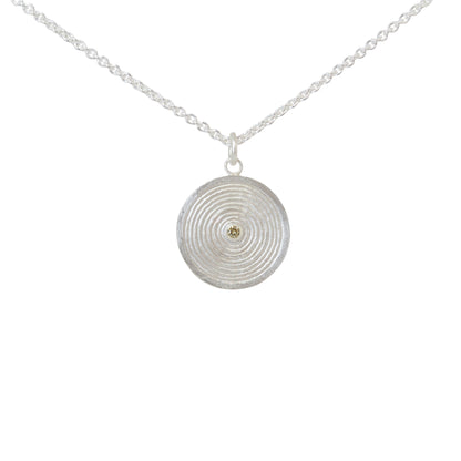 Sterling silver pendant necklace with a circular design set with a yellow diamond